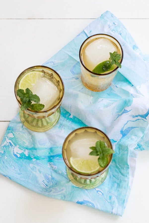 Drinks sitting on blue marbled napkin.