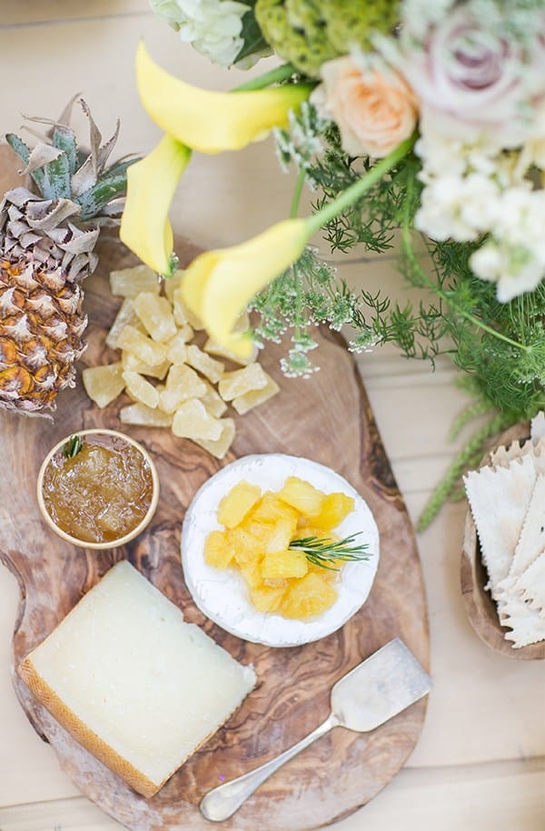 Pineapple cheese plate with dried pineapple and baby pineapple.