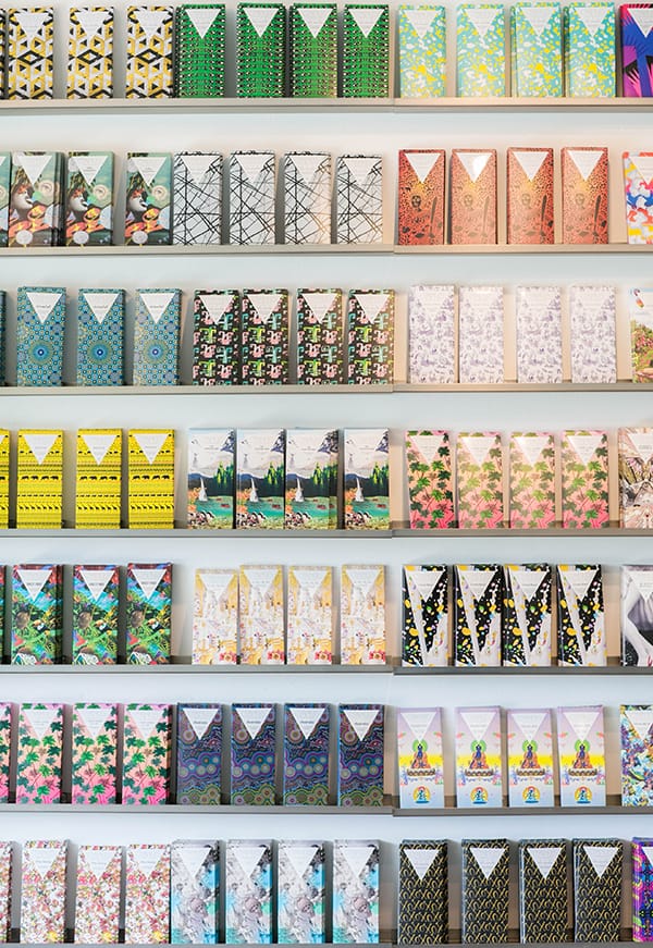 A wall full of colorful wrapped chocolate bars.