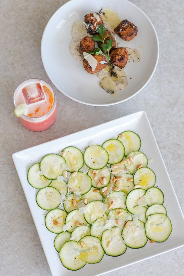 Zucchini, a cocktail and pine nuts