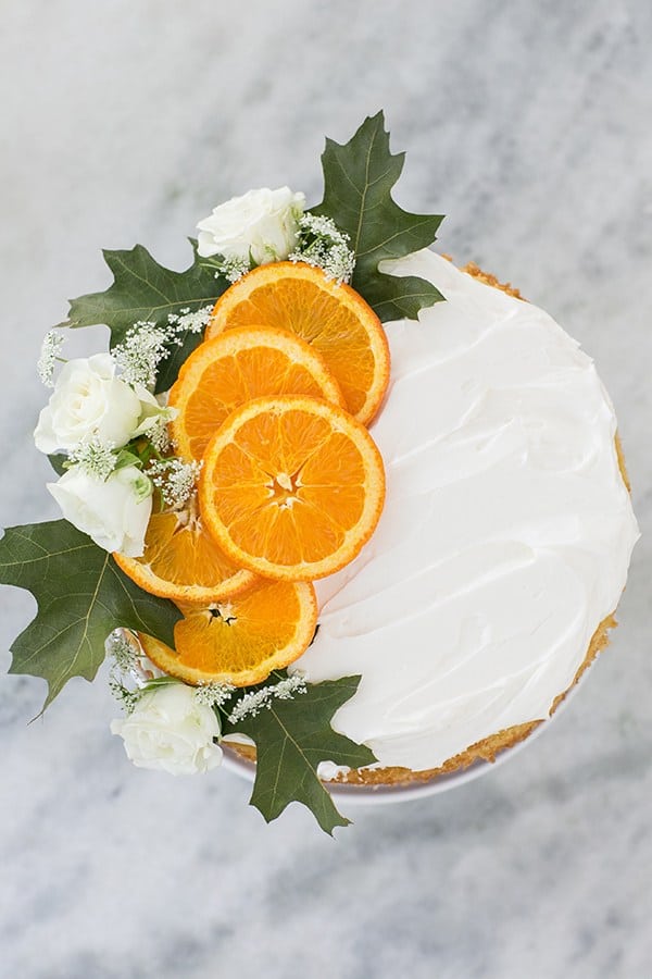 orange cake with sliced oranges and frosting.