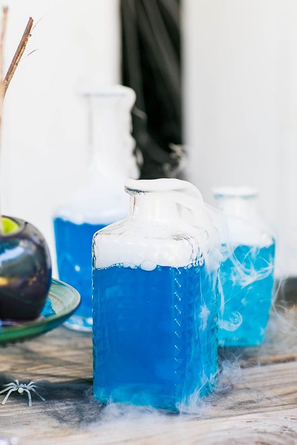 halloween party idea blue cocktail with dry ice