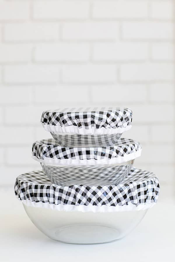 Stack of clear bowls with DIY oil cloth bowl covers - cling wrap
