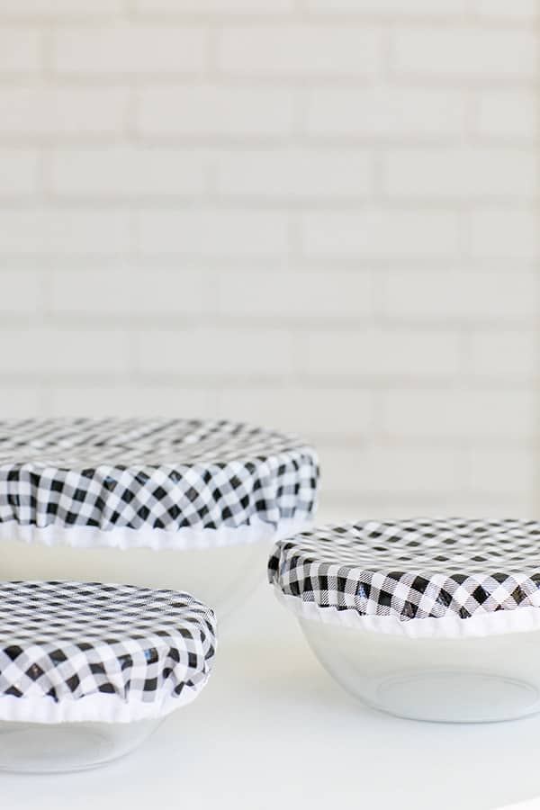 Three clear bowls with black and white oil cloth covers. - reusable bowl covers, cling wrap, reusable bowl, various sizes