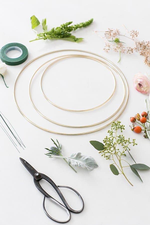 Gold rings with tape, flowers, floral wire.