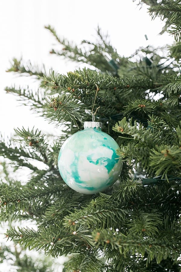 a single marble ornament on a tree