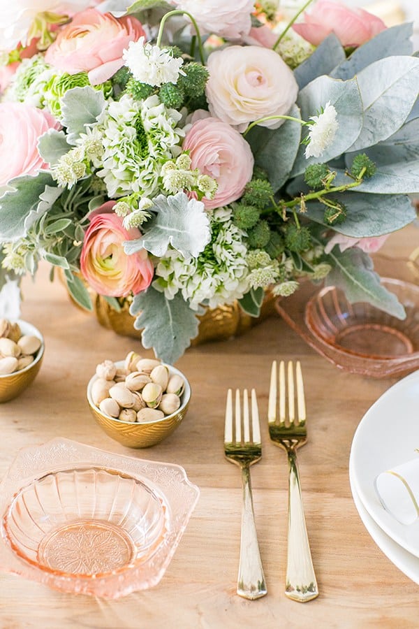 Gold flatware and flowers for New Year's Eve