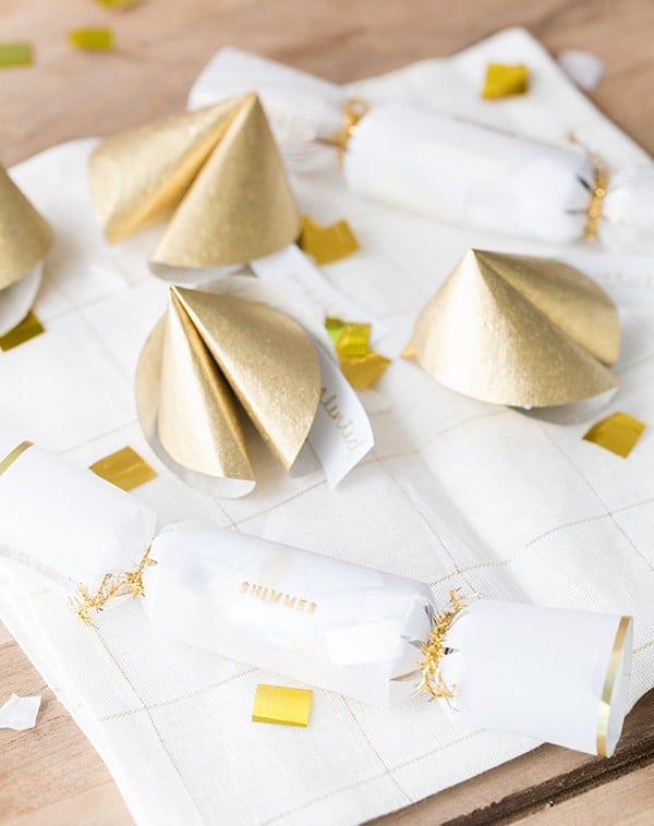 Paper fortune cookies with confetti and napkins