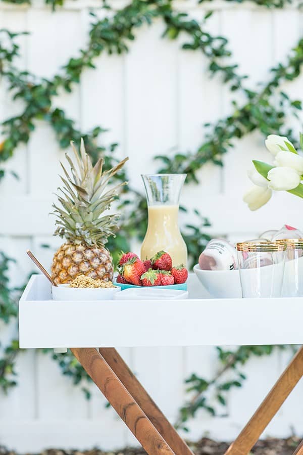 Frozen cocktail and strawberries on a tray 