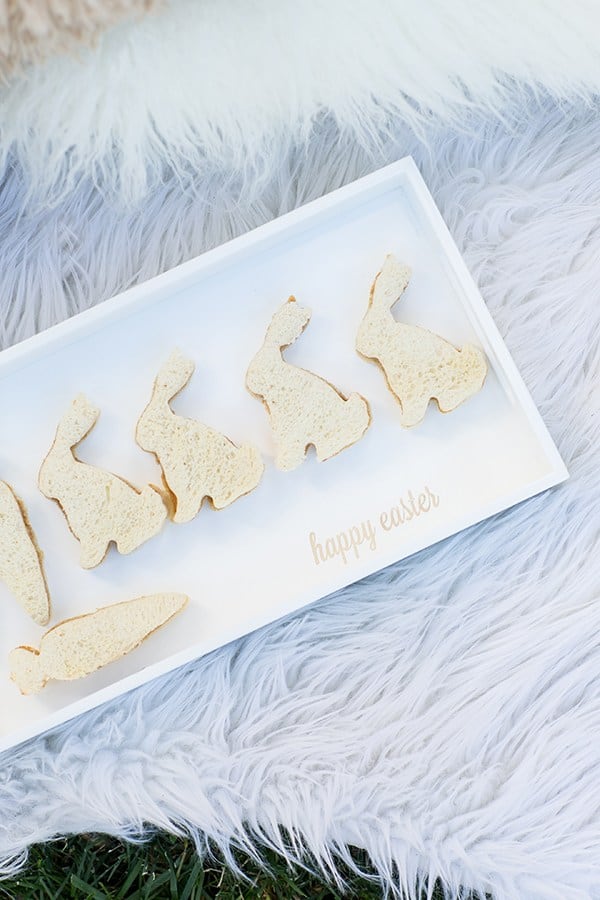 Bunny sandwiches on a tray that says happy Easter 