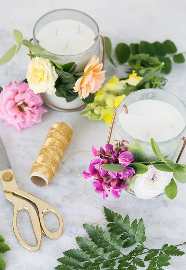 Overhead picture of essential oil candles with fresh flowers - candle making, candles with essential oils, candle burns, essential oil candle making