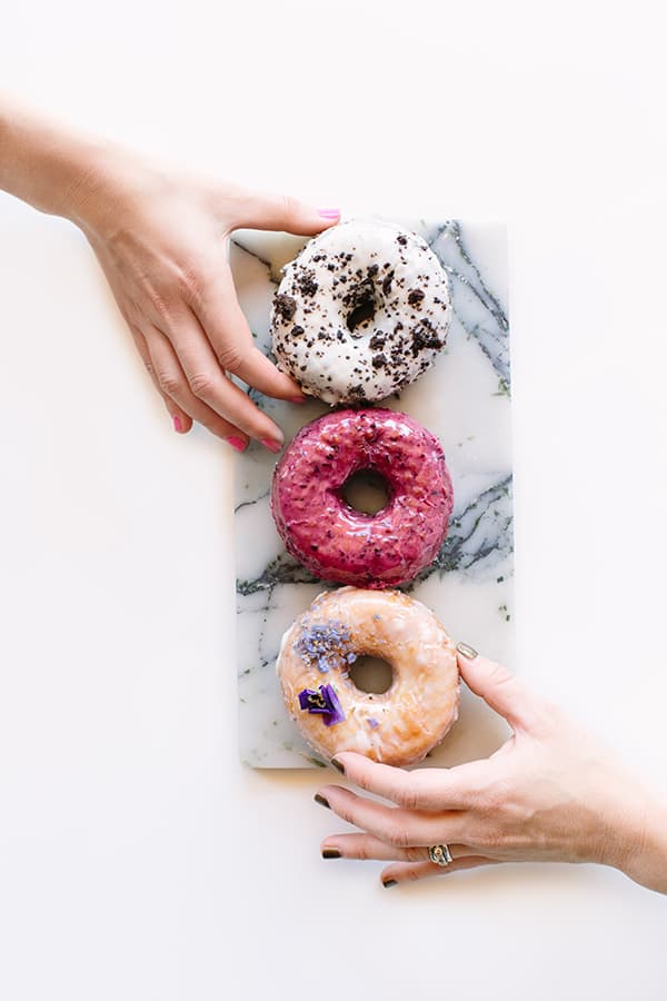 Hand grabbing a doughnut