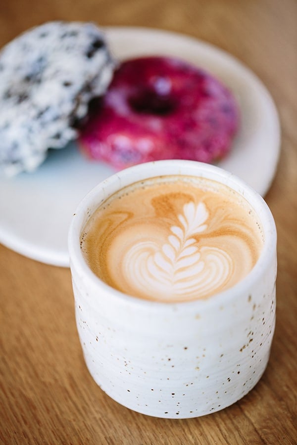 Coffee in white mug at Sidecar Doughnuts