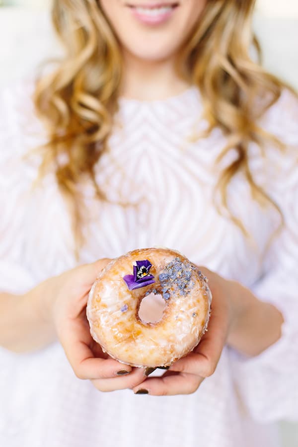 Holding a doughnut at Sidecar 