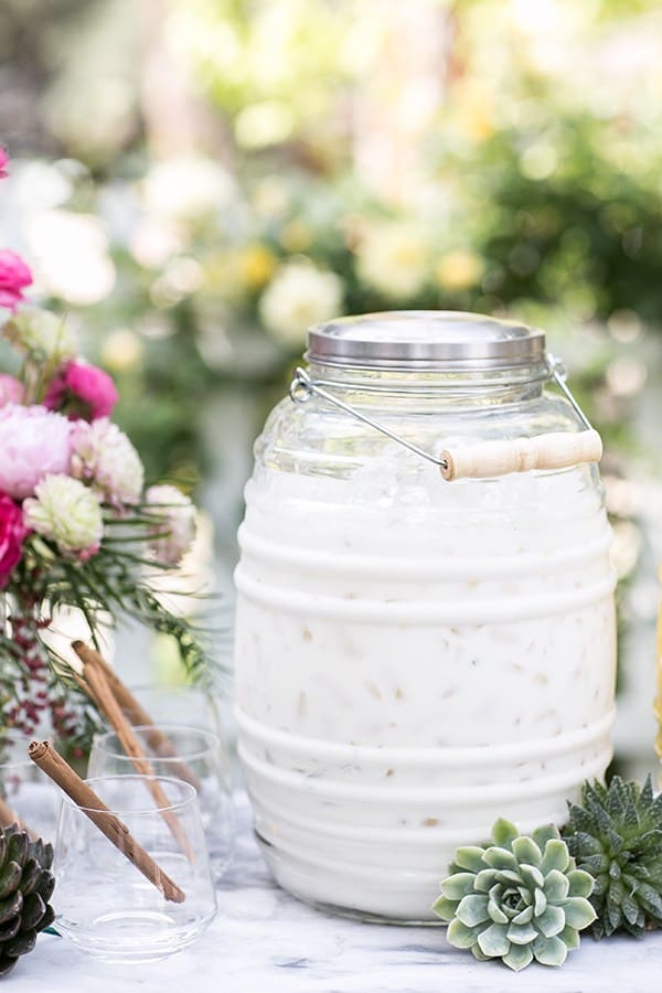 Mexican horchata in a jug with succulents for Cinco de Mayo.