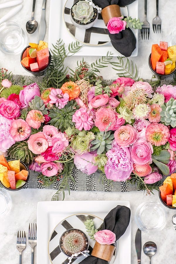 pink flowers on a marble table for Cinco de Mayo 