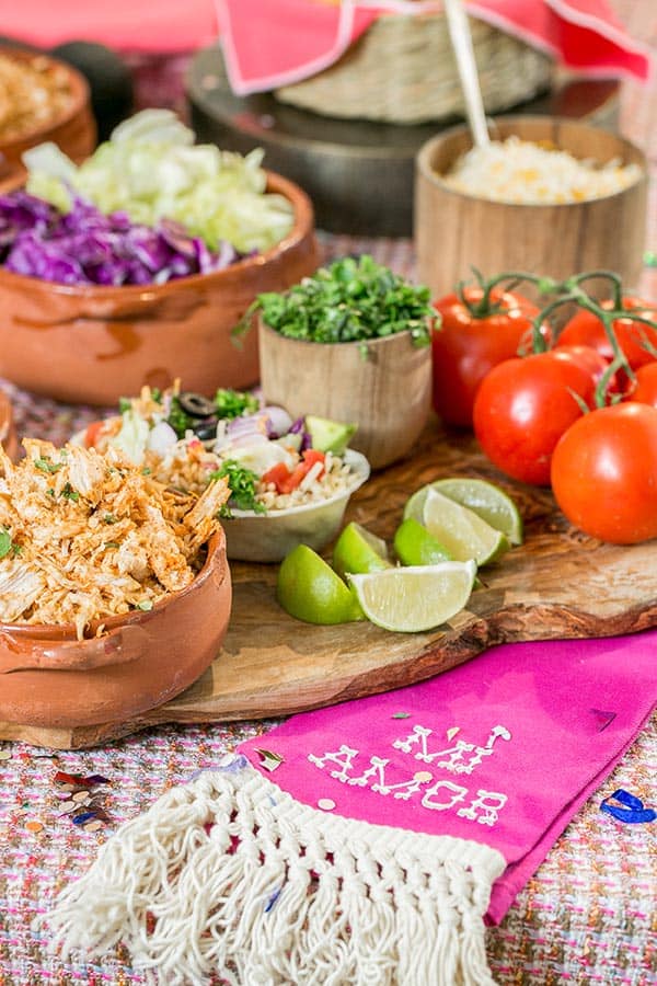 Taco bar ideas and ingredients in wooden bowls. 