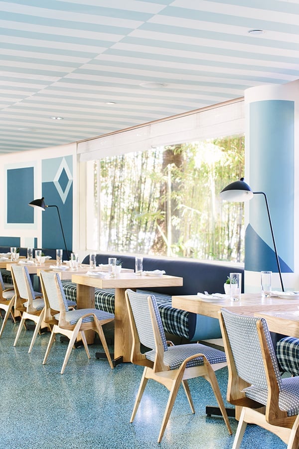 Stripe blue ceiling with modern tables.