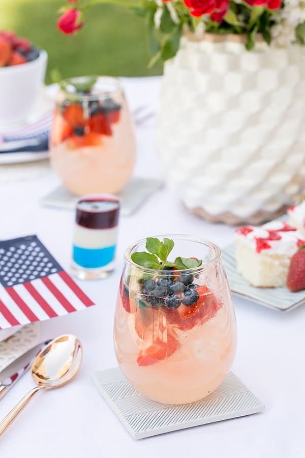 side shot of easy summer cocktails on a table with flags