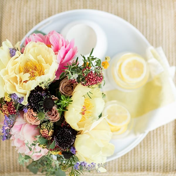 Overhead picture of beautiful flowers with lemonade 