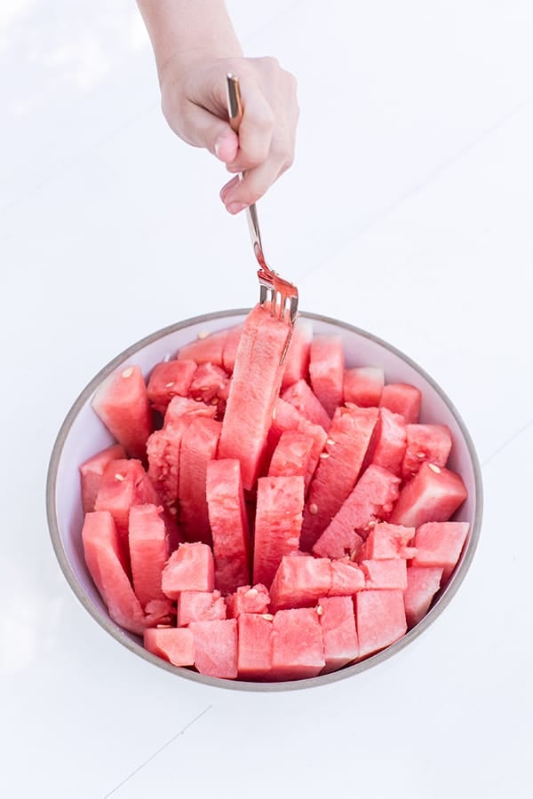 fork grabbing a watermelon stick