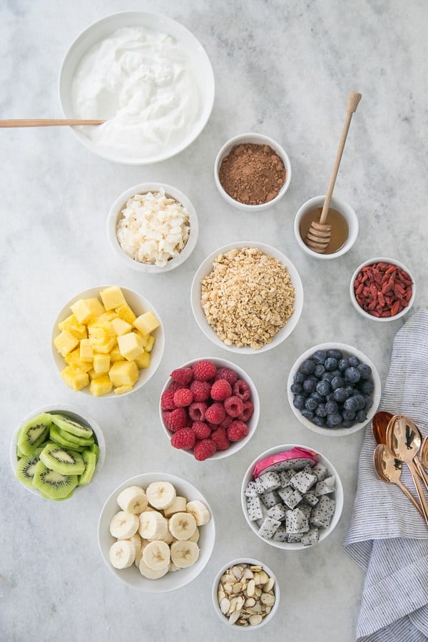 yogurt bowl station with fruit, honey, greek yogurt and more! 