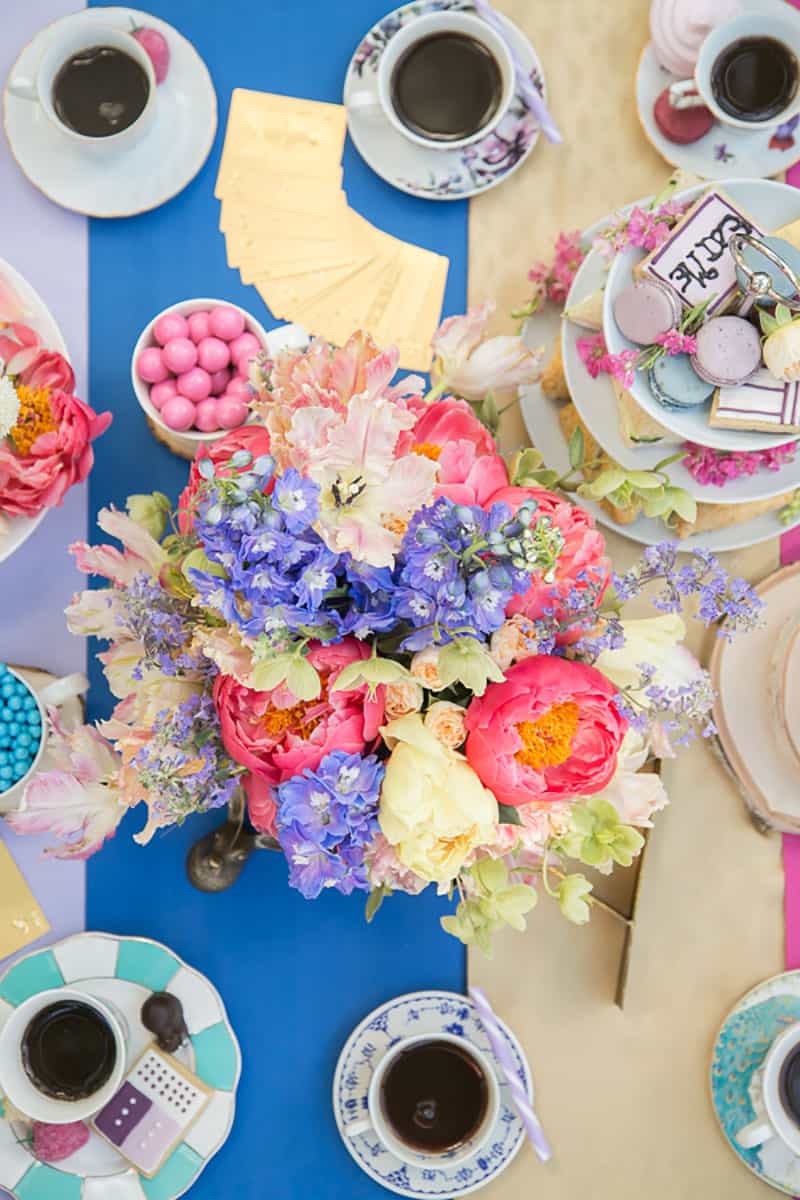 colorful tea party with flowers and tea cups.