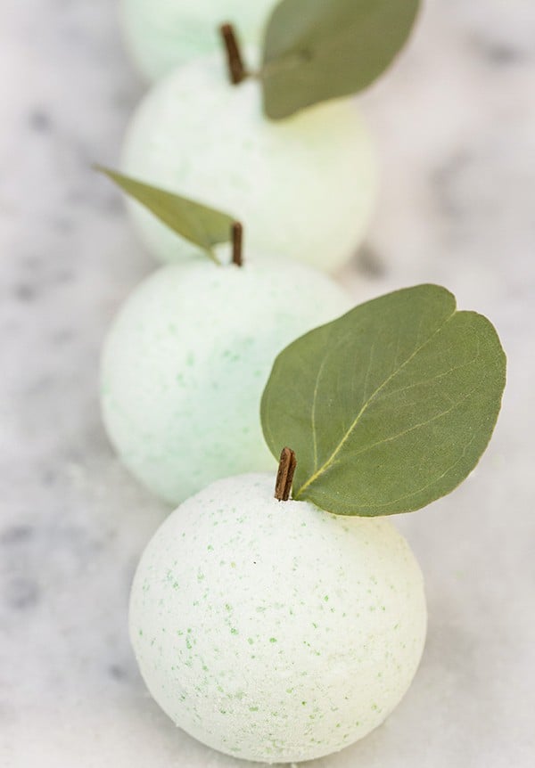 Bath bombs DIY shaped as green apples. 