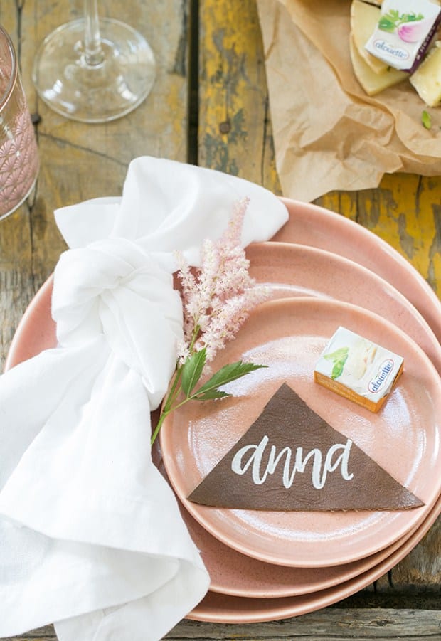 top down shot of plates with name tags - charcuterie board