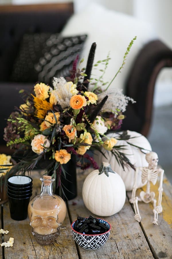 Skull decanter, halloween flowers and halloween decorations. 