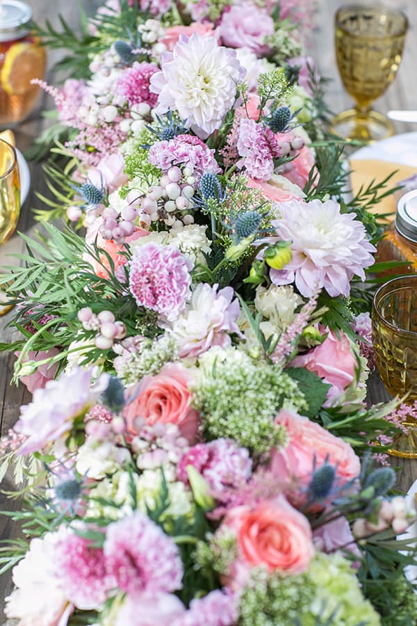 Colorful flowers on a wooden table. 