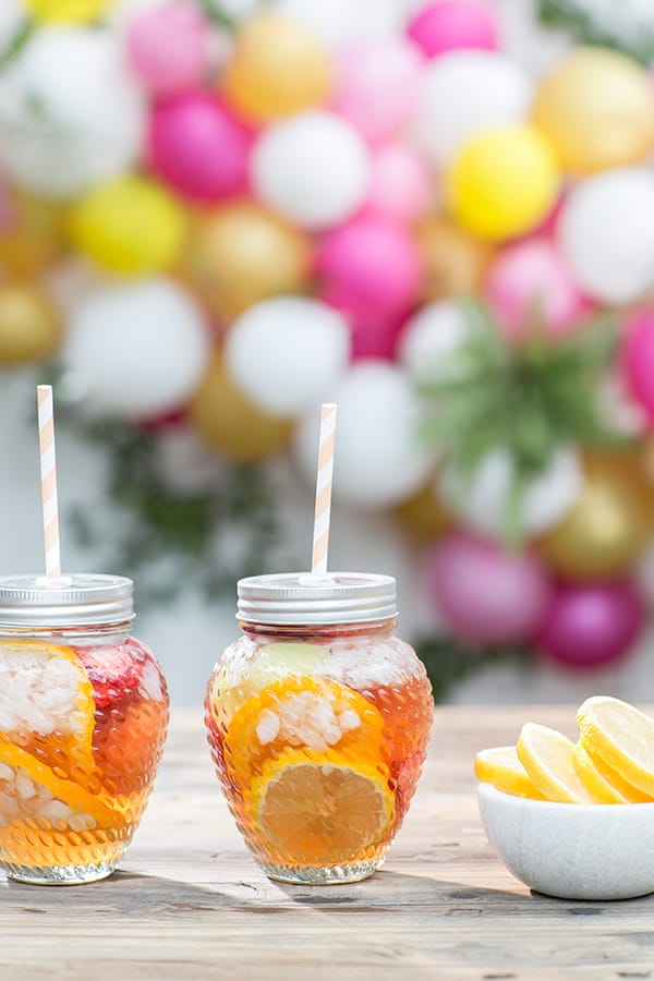 Rose in a glass with lid and straw 