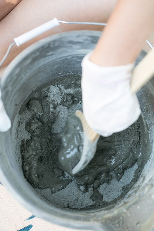 concrete mix in a bowl being stirred - cement pumpkin, super excited, too little water, add water, super easy, great thing