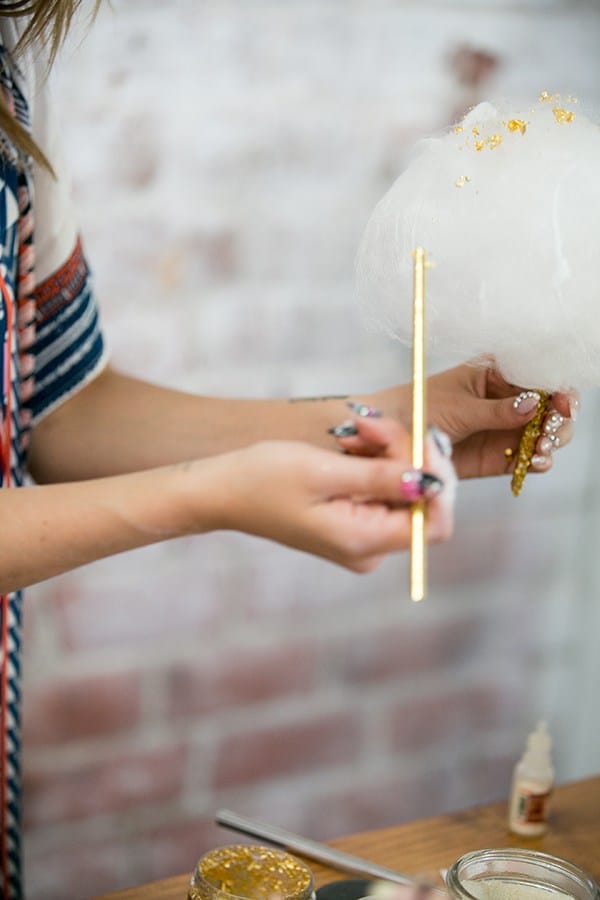 Putting gold leaf on cotton candy - fall baby shower ideas, baby shower theme, little pumpkin baby shower