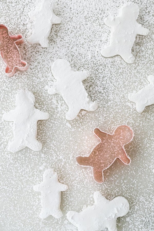 How to make marshmallows on a marble table with a gingerbread cookie cutter and gingerbread marshmallow shapes.