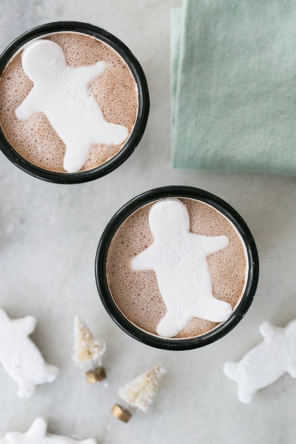 Two homemade marshmallows in a cup of hot chocolate 