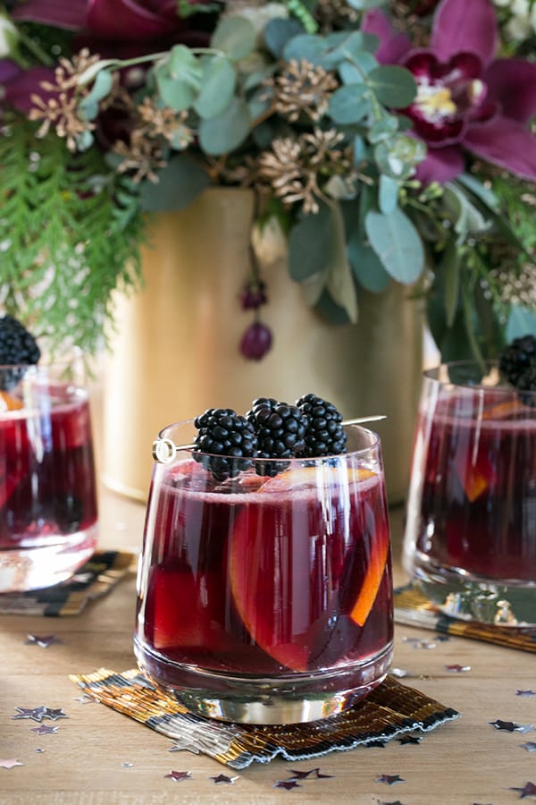 Glass of sangria with blackberries. 