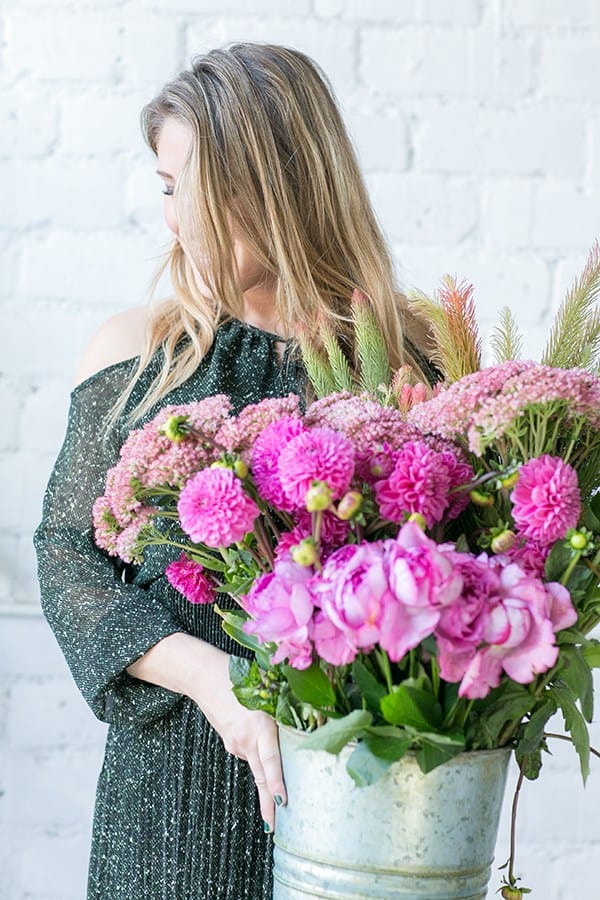 shot of guest holding flowers at the wreath making party