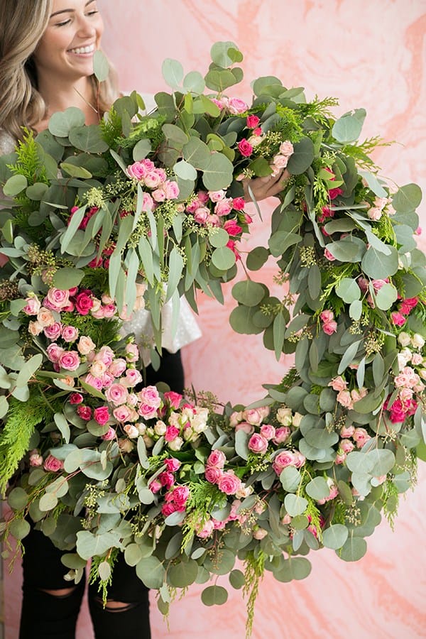 shot of guest holding up a wreath