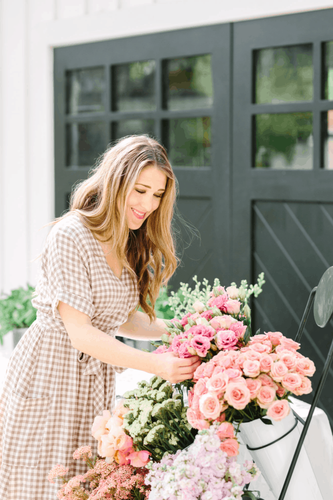 woman arranging flowers