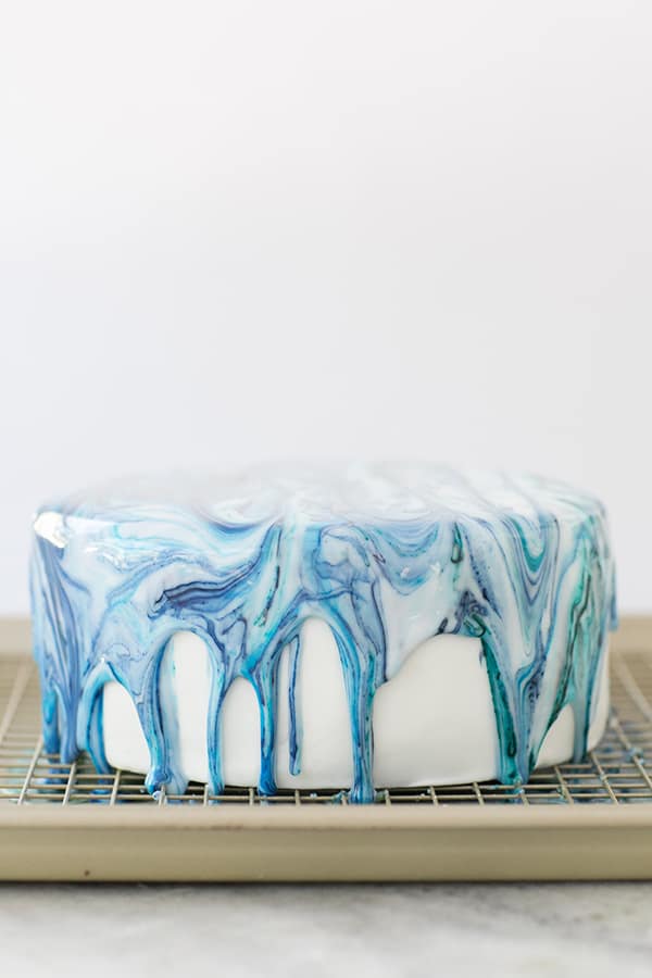 Shot of a marble drip cake on a tray