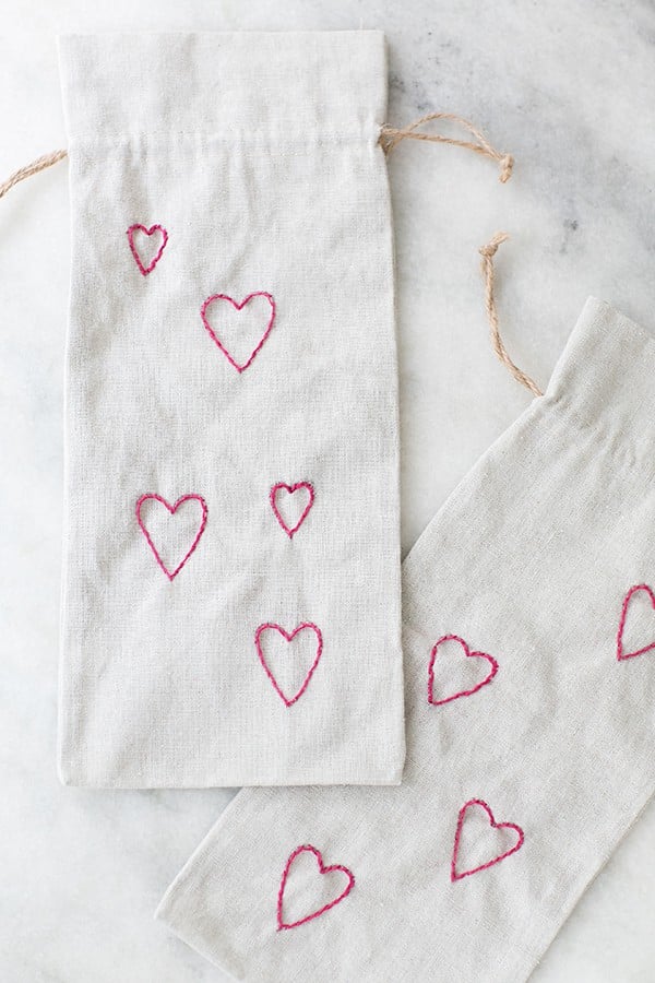 Valentine's Day wine bags with tiny embroidery hearts.