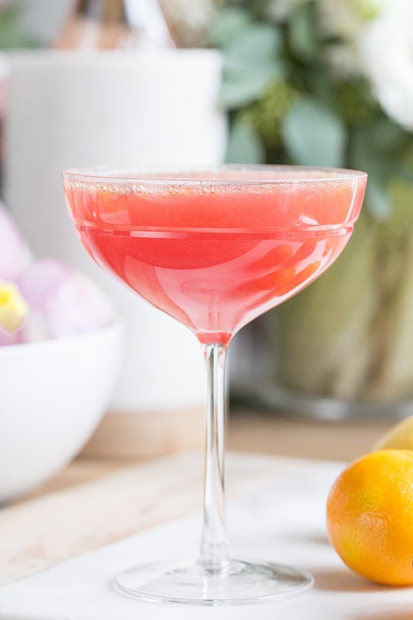 A pretty Easter brunch cocktail in a coupe glass.