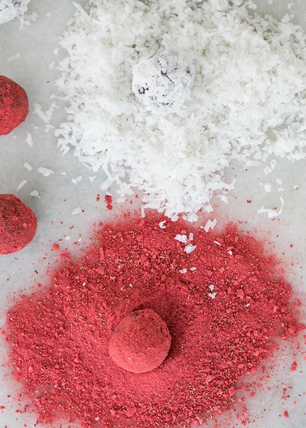 top down shot of coconut truffles with coconut and strawberry coating