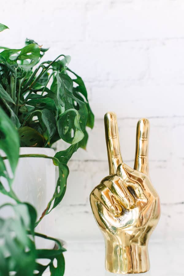 Gold peace sign hand