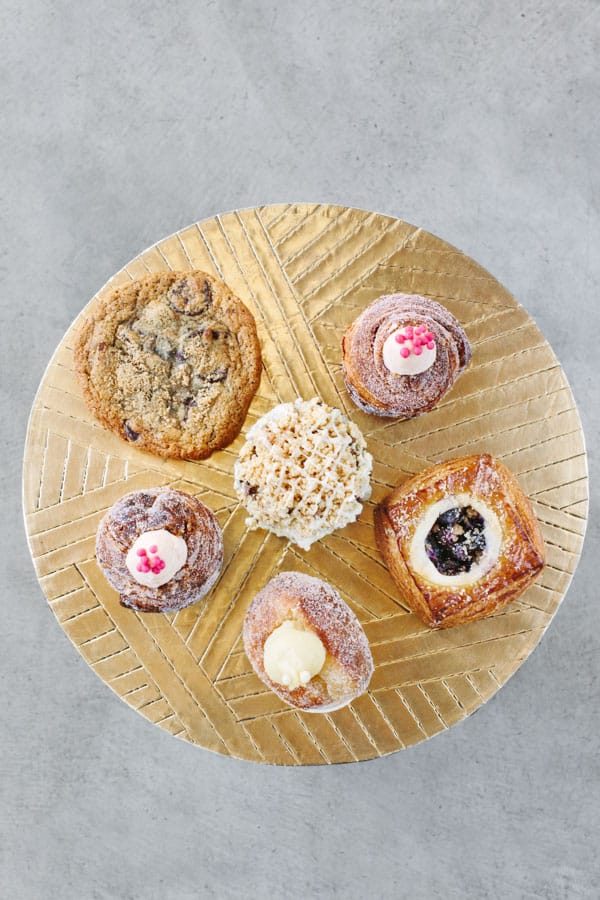 Treats on a gold table from Mr. Holmes Bakery 