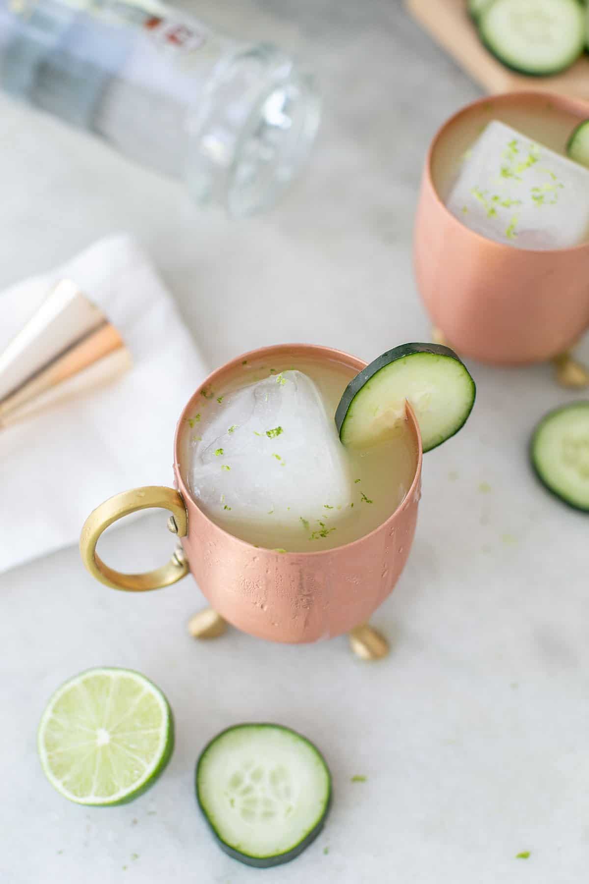 Moscow mule cocktail with cucumber and lime zest 