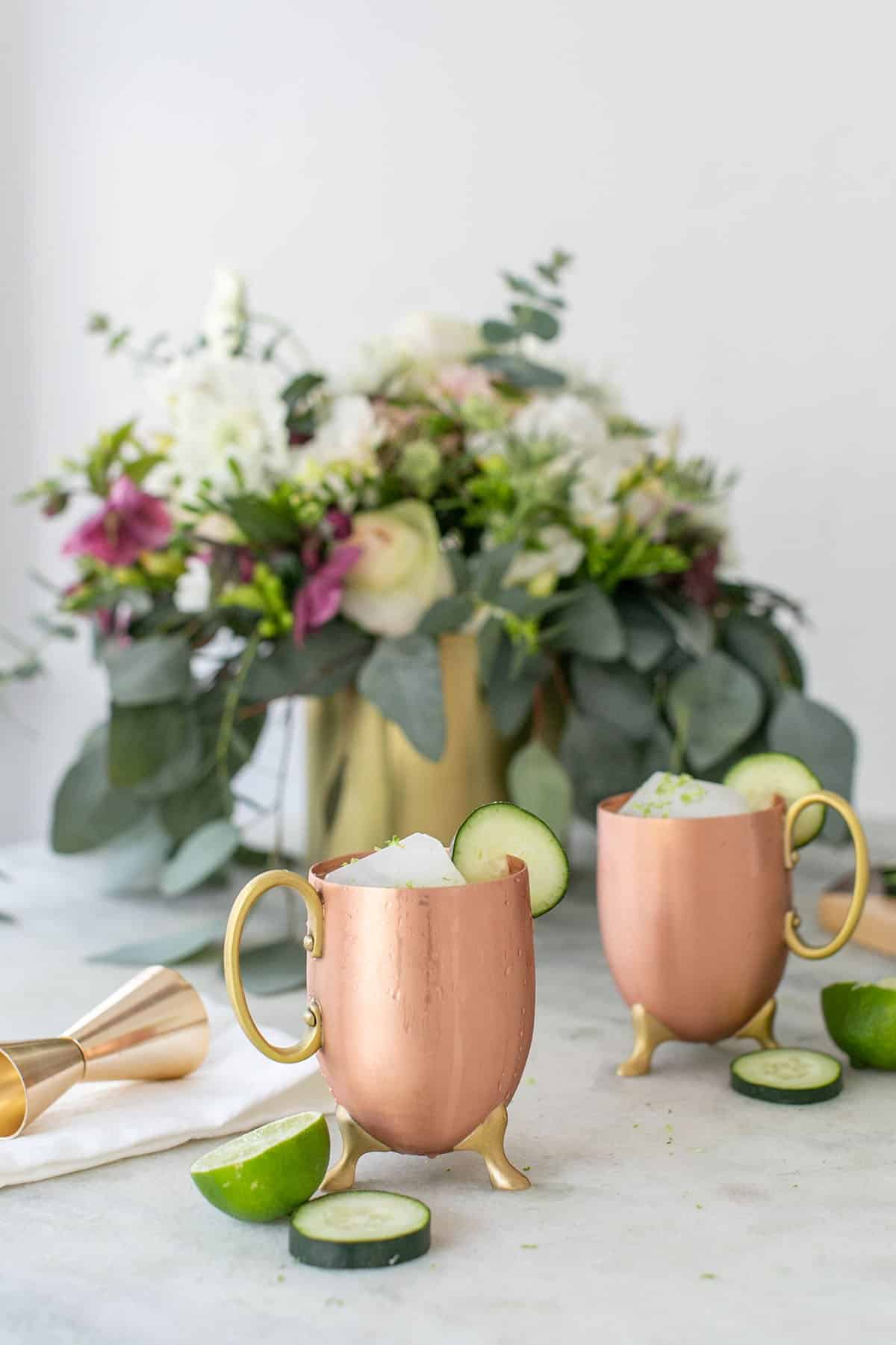Moscow mule in a copper mug with lime and flowers