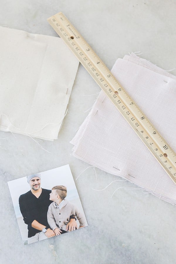 picture, ruler and linen fabric on a marble table.