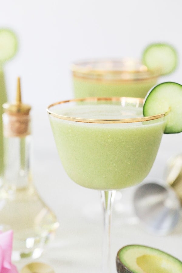 cucumber avocado daiquiri recipe in a glass with a cucumber